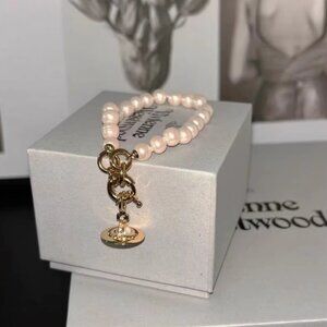 Vivienne Westwood Pearl Bracelet – Iconic Gold Orb Charm, Elegant & Timeless